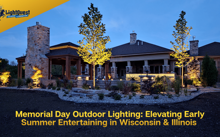 Luxury brick home in Wisconsin and Illinois illuminated with warm architectural landscape lighting, tree lighting, and pathway lighting for summer outdoor safety.